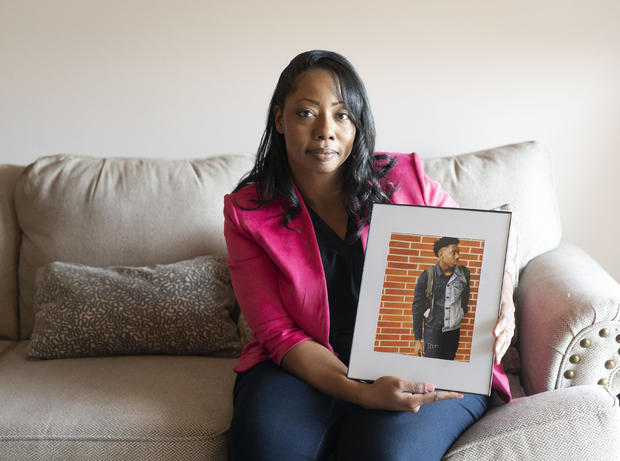 Candace Leslie holds a photo of her late son, Cameron Brown in Indianapolis. Leslie lost her son Cameron in 2021 after he was shot and killed near his apartment complex in Indianapolis. 