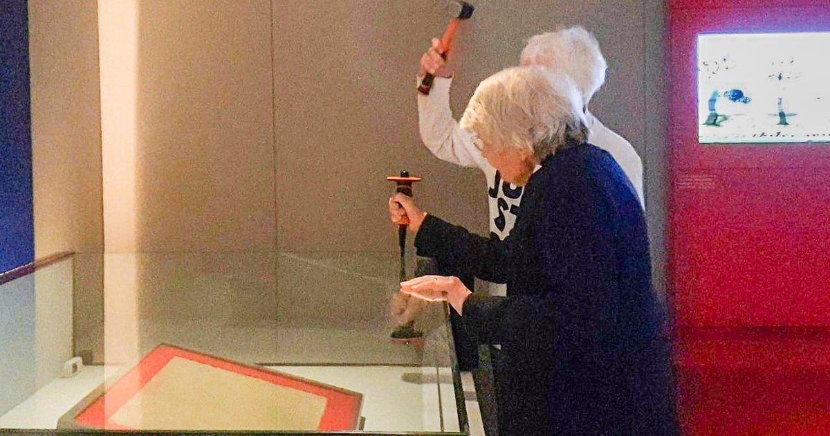 Priest 82 and retired teacher 85 smash case holding copy of Magna Carta in environmental protest CBS News Priest 82 and retired teacher 85 smash case holding copy of Magna Carta in environmental protest CBS News