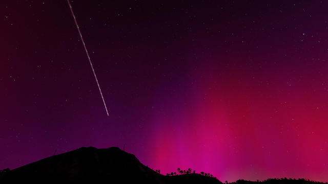 Northern lights are visible over Lake Berryessa, California. 
