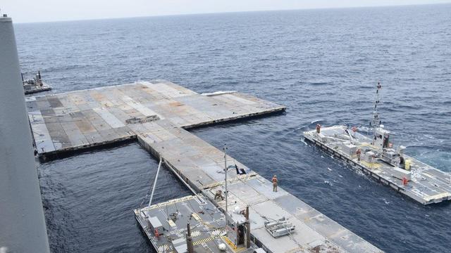 A photo released by the Pentagon shows the construction of the floating pier that will be used to transport humanitarian aid to Gaza on April 26, 2024. 