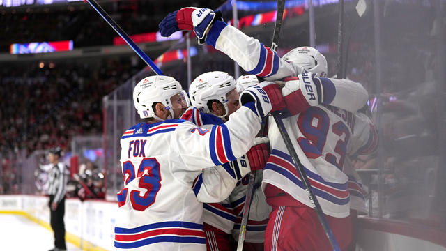 Chris Kreider #20 of the New York Rangers is congratulated by teammates after scoring a goal against the Carolina Hurricanes during the third period in Game Six of the Second Round of the 2024 Stanley Cup Playoffs at PNC Arena on May 16, 2024 in Raleigh, North Carolina. 