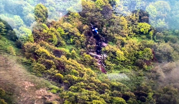 A screen grab captured from video released on May 20, 2024 shows the location of the crash site of the helicopter that was carrying Iranian President Ebrahim Raisi and his delegation in northeast Iran