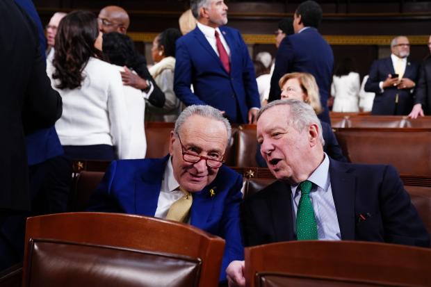 Senate Majority Leader Chuck Schumer chats with Sen. Dick Durbin on the House floor ahead of the annual State of the Union address by President Biden on March 7, 2024, in Washington, D.C.  