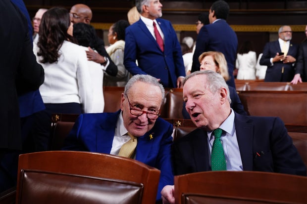 Senate Majority Leader Chuck Schumer chats with Sen. Dick Durbin on the House floor ahead of the annual State of the Union address by President Biden on March 7, 2024, in Washington, D.C.