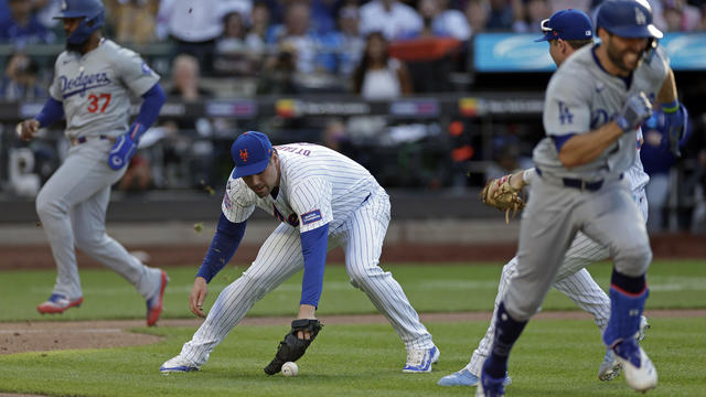 Adam Ottavino #0 of the New York Mets can't handle an RBI bunt by Will Smith #16 of the Los Angeles Dodgers as Teoscar Hernández #37 of the Los Angeles Dodgers scores a run during the ninth inning in game one of a doubleheader at Citi Field on May 28, 202 