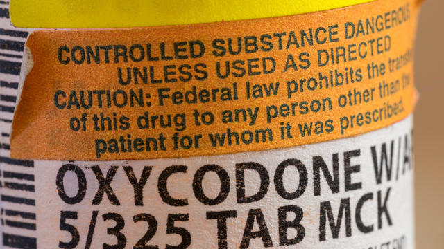 Oxycodone opioid tablets bottle and label in extreme close up for court battle in WV 