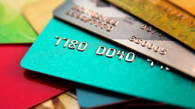 stack of multicolored credit cards, close up view with selective focus 