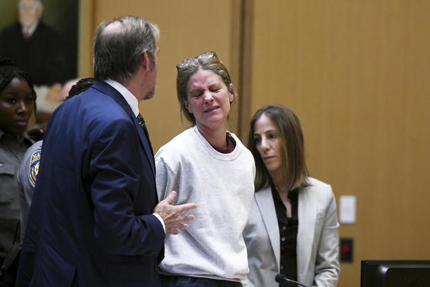 Michelle Troconis speaks with her attorney, Jon Schoenhorn, during her sentencing hearing in Connecticut Superior Court in Stamford, Connecticut, May 31, 2024. 