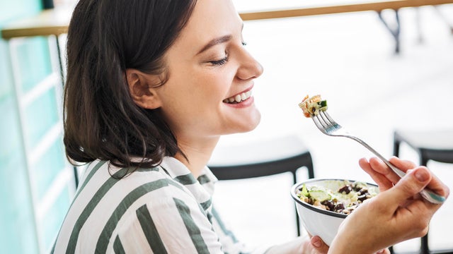 Young woman enjoying salad