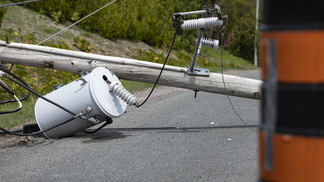 Broken Power Line Lays Across Rural Rode After Heavy Storm 