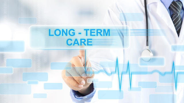 Doctor touching LONG - TERM CARE sign on virtual screen 