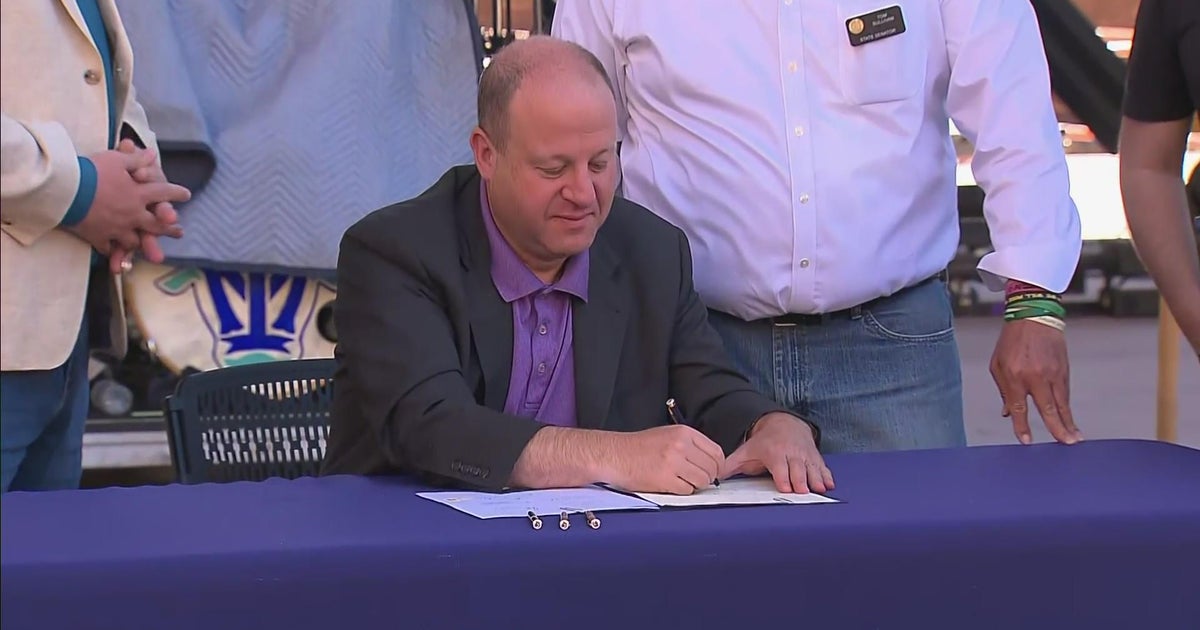 Gov. Jared Polis signs bill into law protecting Colorado consumers from ...