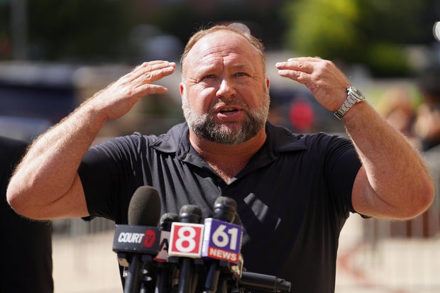 Alex Jones speaks to the media outside the Sandy Hook trial in Waterbury, Connecticut