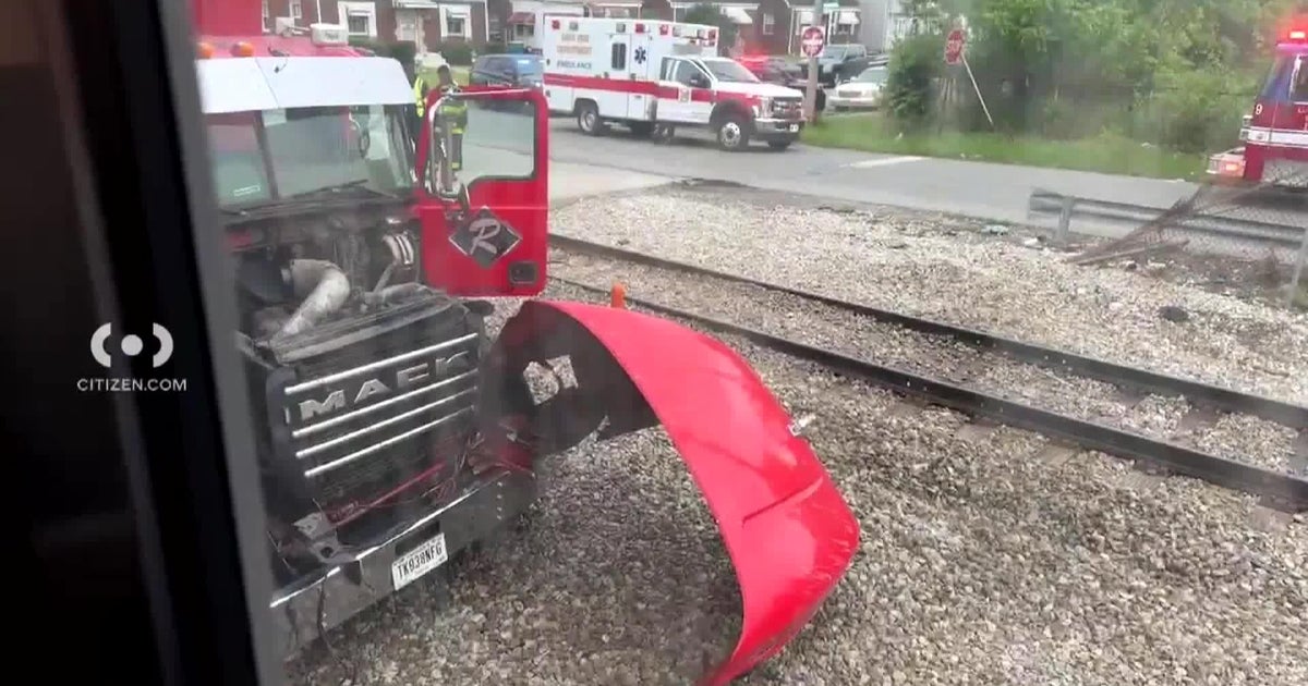 South Shore trains halted after train collides with dump truck - CBS