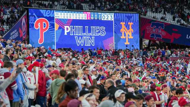 Phillies fans celebrate after the Phillies beat the New York Mets in Game 1 of the London series 