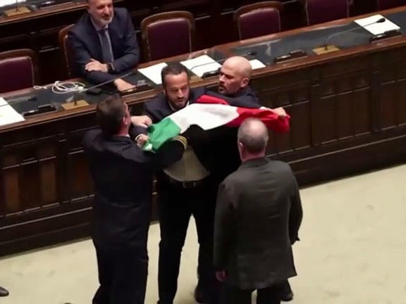 Italian lawmaker Leonardo Donno is detained after approaching Regional Affairs Minister Roberto Calderoli at the Italian Parliament in Rome on June 12, 2024, in a video image capture.