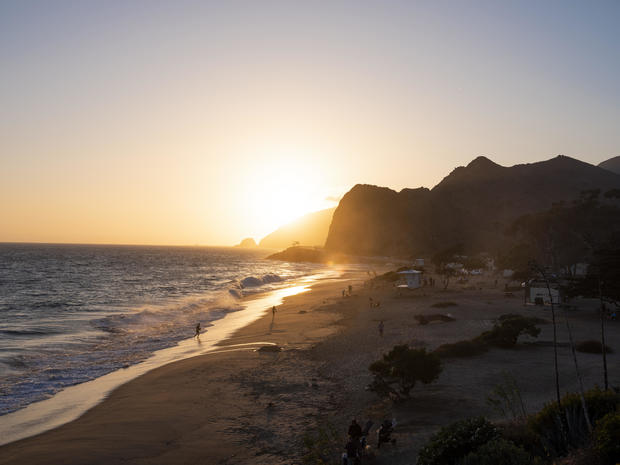 California Beachgoers Enjoy Sand And Surf Before Holiday Weekend Shutdown 