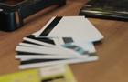 A pile of cards with magnetic strips on a desk. 