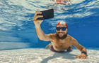 Man taking photos underwater 