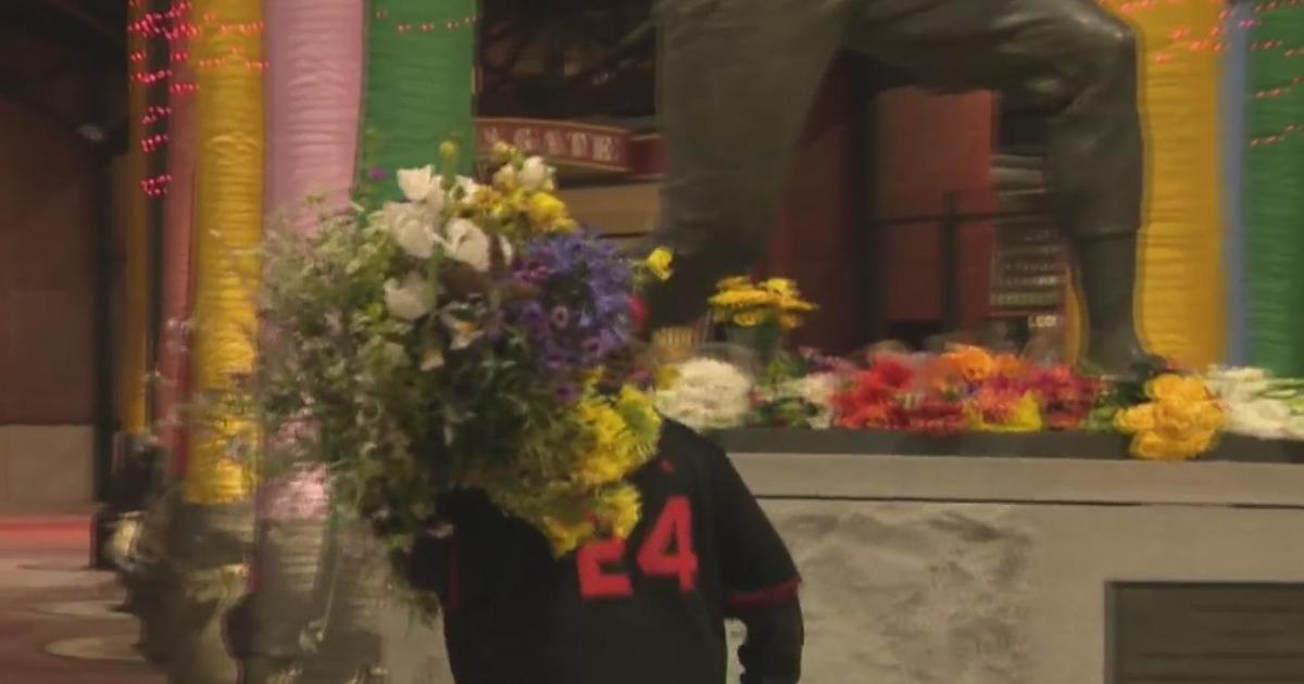 Fans leaving flowers at Willie Mays Plaza in honor of San Francisco Giants legend