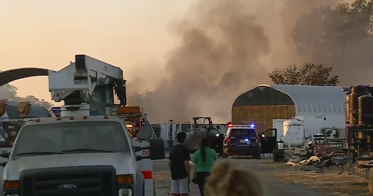 Grass fire spreads and destroys multiple buildings in north Sacramento, officials say