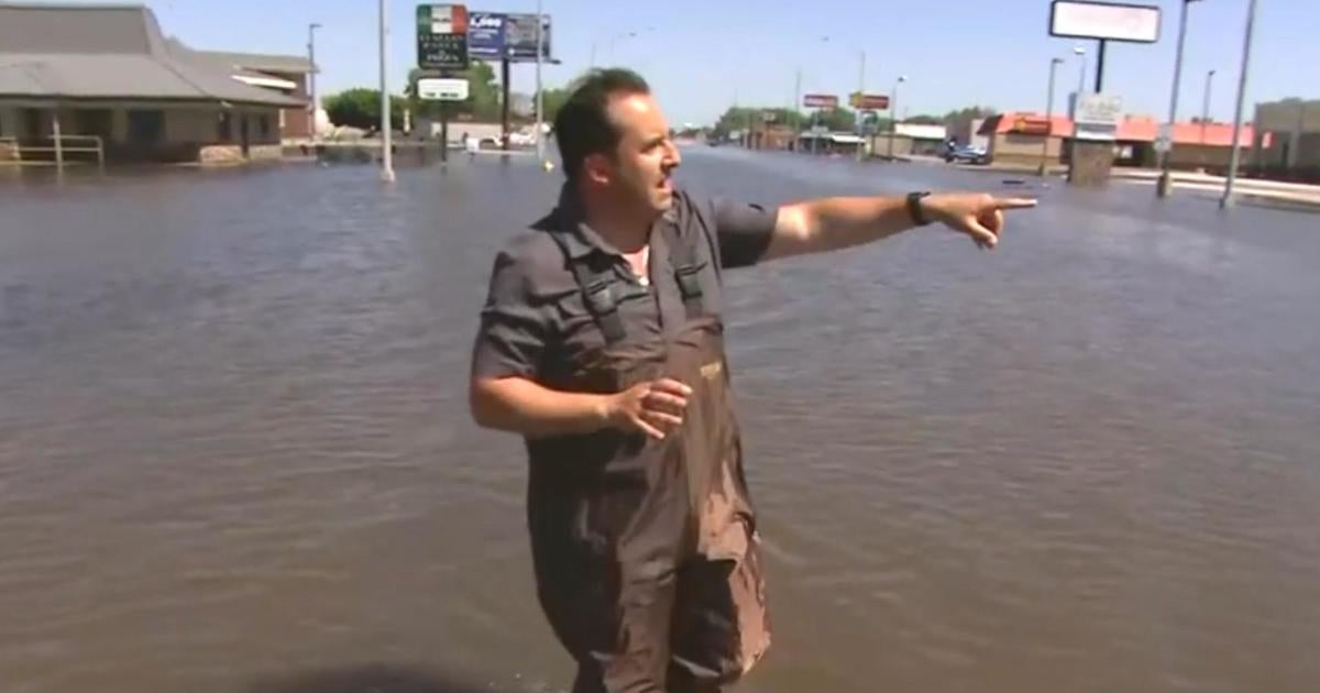 Deadly floods swallow Midwest communities - CBS News