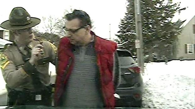 An image taken from police dashcam video shows Gregory Bombard getting arrested on Feb. 9, 2018, in St. Albans, Vermont. 