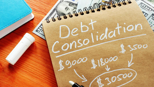 Debt consolidation title with written calculations. 