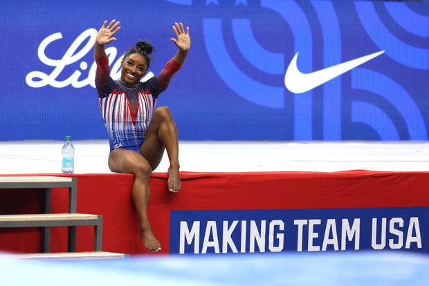 Simone Biles waves to fans at theU.S. Olympic Team Trials 