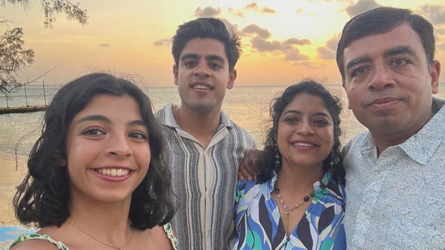 The Jain family poses for a photo outside 