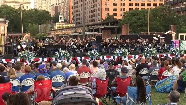 Rows of people watch as the U.S. Army Band performs on Independence Mall in Philadelphia 
