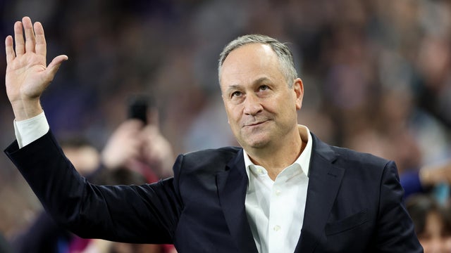 Second gentleman Doug Emhoff waves after lighting the torch before the 2024 NWSL Challenge Cup between the NJ/NY Gotham FC and the San Diego Wave FC at Red Bull Arena on March 15, 2024 in Harrison, New Jersey. 