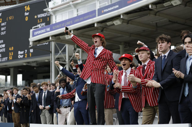 Eton College boys celebrate the first wicket of the day during the Eton v Harrow cricket match at Lords Cricket Ground, in a May 12, 2023 file photo in London, England.