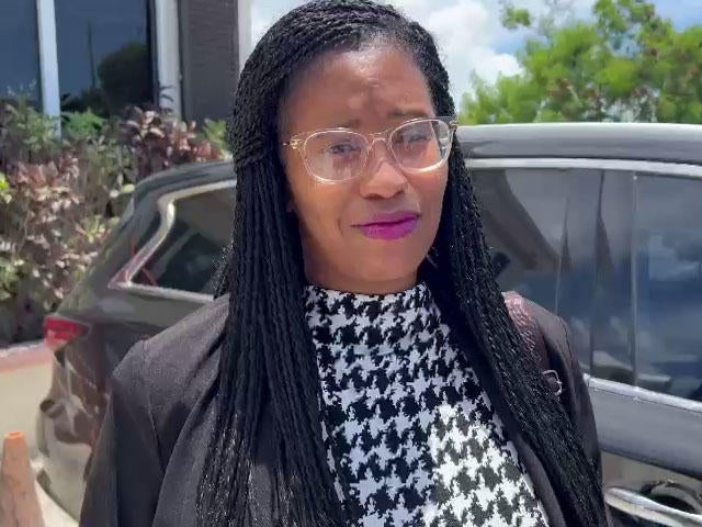 Sharitta Grier speaks with reporters after her sentencing for having ammunition in the Turks and Caicos Islands, July 11, 2024. 