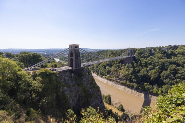 Man charged with murdering 2 roommates after body parts found in suitcases on iconic U.K. bridge