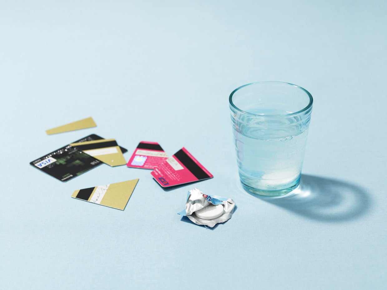Credit cards and headache tablet 