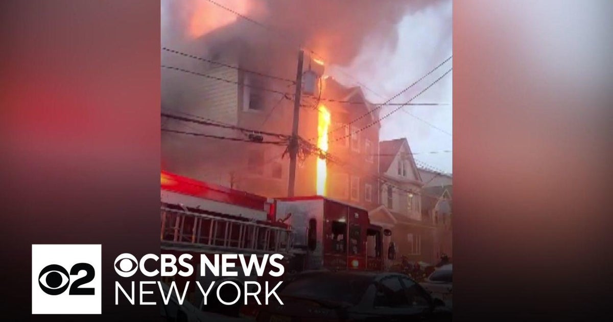 2 firefighters injured battling Newark apartment building fire - CBS ...
