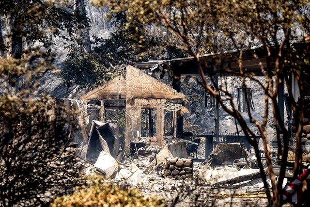 Charred walls stand at a residence destroyed by the Park Fire on Sycamore Valley Road near Chico, Calif., on July 25, 2024.