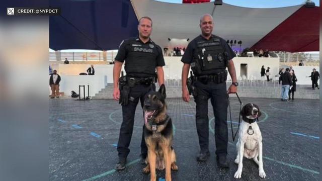 NYPD Officer Michael Finamore with K-9 Gunner and Officer Rafael Delacruz with K-9 Davey outside an Olympics venue in Paris. 