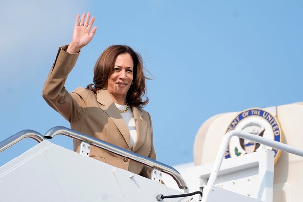 Vice President and Democratic presidential candidate Kamala Harris waves while boarding Air Force Two from Westfield-Barnes Regional Airport in Westfield, Massachusetts, on July 27, 2024, as she returns to Washington, DC, after attending a campaign fundra