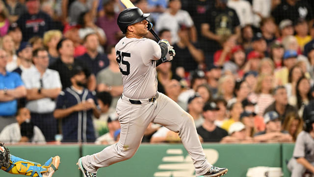 leyber Torres #25 of the New York Yankees hits a two-run RBI double against the Boston Red Sox.during the tenth inning at Fenway Park on July 27, 2024 in Boston, Massachusetts. 