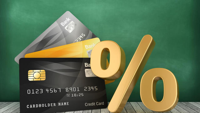 Credit Cards with Percentage Symbol on Chalkboard - 3D Rendering 