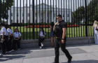 A member of the Secret Service patrols outside the White House on Tuesday, July 23, 2024, in Washington. 