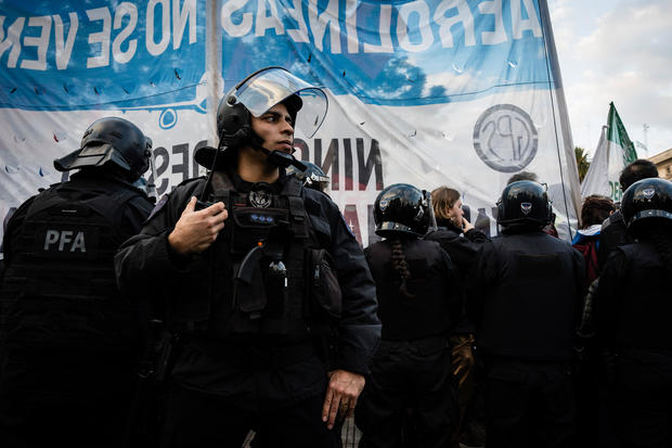 Police surround the protesters during the protest 