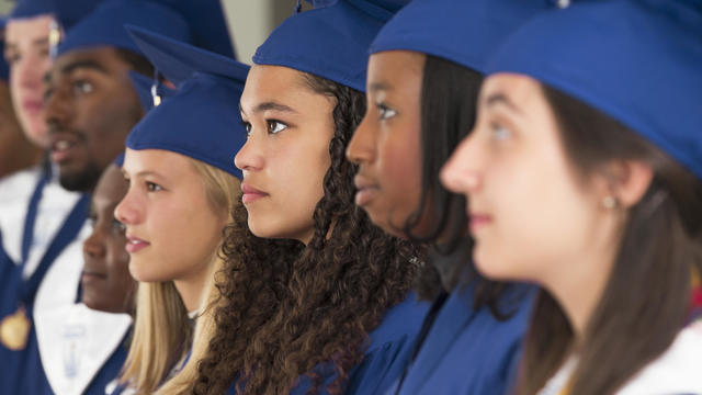 Students standing together during graduation 