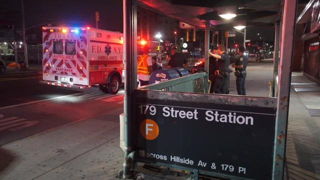 An ambulance sits parked outside the entrance to the 179th Street station in Queens. 