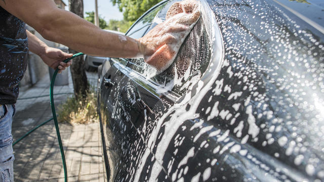 Man washing his car, close-up 