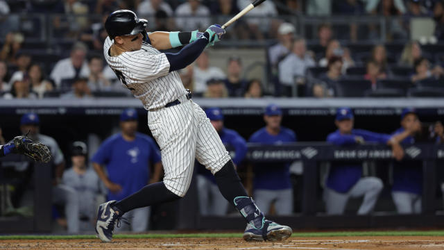 Aaron Judge #99 of the New York Yankees hits a home run during the game between the Toronto Blue Jays and the New York Yankees at Yankee Stadium on Friday, August 2, 2024 in New York, New York. 