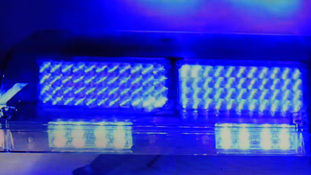 Bright blue colored police car lights flashing 