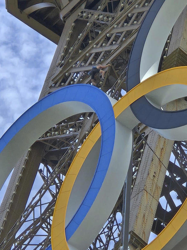 Shirtless guy observed mountaineering up Eiffel Tower hours sooner than Olympics ultimate rite